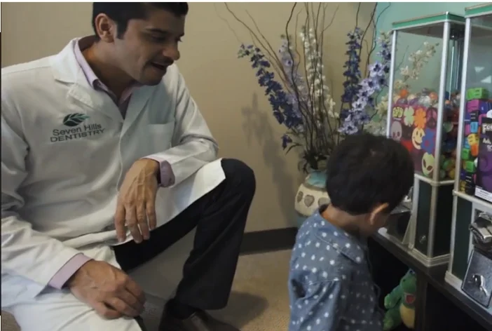 Dr. Ron Hassanzadeh talking to kid patient