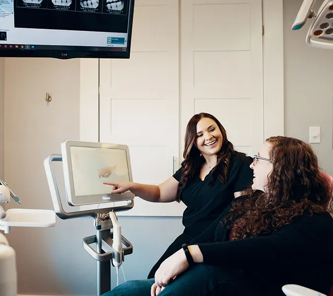 Female Dentist talking to patient dental marketing
